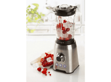 Charger l&#39;image dans la galerie, Un blender en acier inoxydable rempli de glace, de fraises et de baies rouges.
