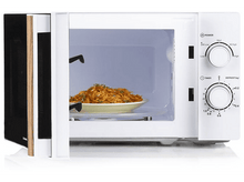 Charger l&#39;image dans la galerie, Un four à micro-ondes blanc avec une assiette de nourriture à l&#39;intérieur et la porte légèrement ouverte.
