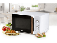 Charger l&#39;image dans la galerie, Un micro-ondes blanc avec une porte noire. Il y a de la nourriture à gauche et du pain à droite.
