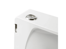 Charger l&#39;image dans la galerie, Un objet blanc avec un bouton argenté. Il a un design élégant et moderne.
