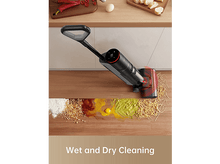 Charger l&#39;image dans la galerie, Un aspirateur sans fil sur un sol en bois, avec des ingrédients alimentaires renversés devant.
