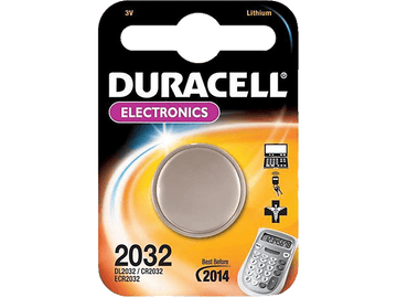 Emballage d'une pile Duracell 2032. Pile grise avec emballage et texte en noir et blanc.