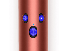 Charger l&#39;image dans la galerie, Sèche-cheveux Dyson, couleur cuivre, avec boutons de commande visibles.
