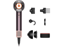 Charger l&#39;image dans la galerie, Sèche-cheveux Dyson et accessoires. Palette de couleurs rose et cuivre. Fond noir.
