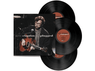Pochette de l'album Eric Clapton unplugged et disques vinyles. Homme avec guitare sur l'image.