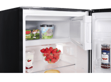 Charger l&#39;image dans la galerie, Réfrigérateur ouvert avec fraises, crème glacée et confiture. Intérieur noir et blanc.
