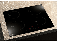 Charger l&#39;image dans la galerie, Une table de cuisson à induction noire avec quatre brûleurs circulaires sur un comptoir en granit.
