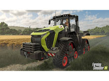 Charger l&#39;image dans la galerie, Un tracteur dans un champ avec un agriculteur au siège du conducteur.
