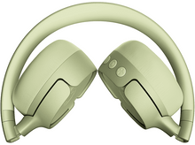 Charger l&#39;image dans la galerie, Casque vert pliable, ouvert, sur une surface blanche, vue de dessus.
