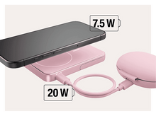 Charger l&#39;image dans la galerie, Un téléphone se recharge sans fil sur un socle rose.
