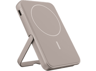 Un chargeur sans fil portable gris avec un support. Le chargeur a une surface de chargement circulaire.