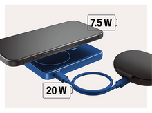 Charger l&#39;image dans la galerie, Téléphone en charge sur un socle bleu. Le téléphone est noir. Le socle a un fil vers un accessoire noir.
