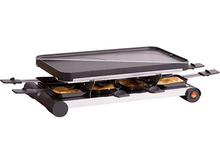 Charger l&#39;image dans la galerie, Gril à raclette avec poêlons à fromage. Le gril a un dessus noir et une base argentée.
