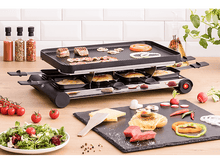 Charger l&#39;image dans la galerie, Gril à raclette avec nourriture, viande, légumes, fromage et pain. La table est en bois, et il y a un mur blanc.
