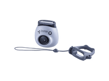 Charger l&#39;image dans la galerie, Appareil photo Instax bleu clair avec une poignée et une sangle. L&#39;appareil photo a un objectif et un flash.
