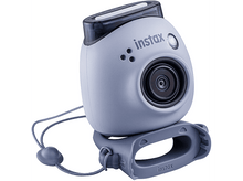Charger l&#39;image dans la galerie, Appareil photo Instax bleu clair avec une sangle et une poignée assorties. Objectif sombre et flash visibles.
