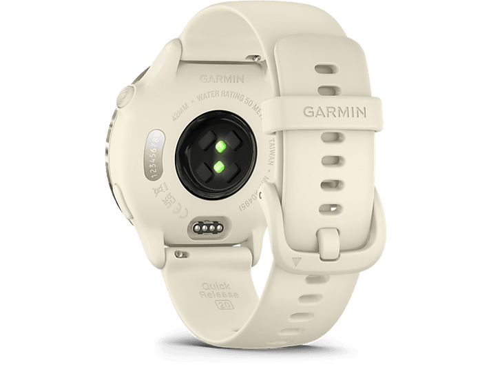 Montre connectée Garmin, couleur crème, vue arrière. Affiche le capteur de fréquence cardiaque et le système de libération rapide. Texte : Garmin, 42mm, Quick Release.