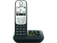 Un téléphone sans fil noir et blanc avec un affichage numérique indiquant l'heure.