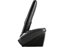 Charger l&#39;image dans la galerie, Un téléphone sans fil noir est sur sa base de chargement. Le téléphone est incliné vers le haut.
