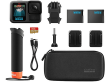 Charger l&#39;image dans la galerie, Une collection d&#39;accessoires GoPro, dont une caméra, des batteries, des fixations, une poignée et un étui de transport.
