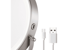 Charger l'image dans la galerie, Gros plan d'un miroir argenté, circulaire et éclairé et d'un câble USB blanc et d'une tête de chargement.
