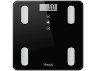 Une balance numérique noire avec un écran affichant '0,0 kg'. Elle possède quatre plateformes blanches.