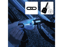 Charger l&#39;image dans la galerie, Un antivol de vélo avec une clé insérée. Deux icônes représentent un maillon de chaîne et une clé avec une ampoule.
