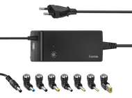 Adaptateur secteur noir et gris avec plusieurs embouts, un port USB et un cordon d'alimentation.