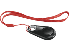 Charger l&#39;image dans la galerie, Trouve-clés ovale noir avec un cordon rouge. L&#39;appareil a un bouton et un anneau blanc.
