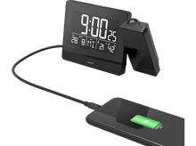 Charger l&#39;image dans la galerie, Une horloge noire avec un téléphone en charge.
