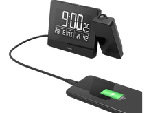 Charger l&#39;image dans la galerie, Une horloge numérique noire avec un smartphone en charge.
