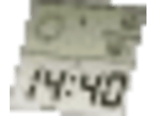 Charger l&#39;image dans la galerie, Un salon avec un canapé gris, une table, une sculpture de chat, un tapis et des lumières décoratives en arrière-plan.
