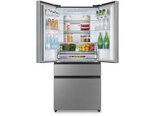 Charger l&#39;image dans la galerie, Un réfrigérateur en acier inoxydable avec des portes ouvertes, rempli de nourriture et de boissons.
