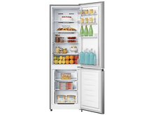 Charger l&#39;image dans la galerie, Un réfrigérateur avec la porte ouverte, montrant des étagères de nourriture et de boissons.
