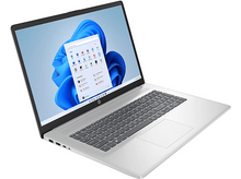 Charger l&#39;image dans la galerie, Un ordinateur portable argenté affiche l&#39;interface Windows 11, ouvert. L&#39;écran affiche le menu Démarrer avec des icônes d&#39;applications. Le clavier et le pavé tactile sont visibles.
