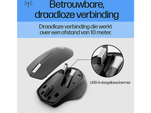 Charger l'image dans la galerie, Souris sans fil noire avec un récepteur USB, gros plan sur le récepteur et la base de la souris.
