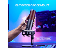 Charger l&#39;image dans la galerie, Un microphone noir avec une grille rouge sur un support, tenu par une main.
