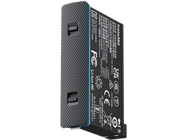 Batterie de caméra Insta360. Noir et argent avec une texture en grille, marquages FCC et autres visibles.