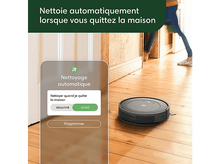 Charger l&#39;image dans la galerie, Un aspirateur robot sur un plancher en bois avec un panneau de contrôle à gauche.
