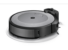 Charger l&#39;image dans la galerie, Aspirateur robot sur une surface blanche, avec station de charge.
