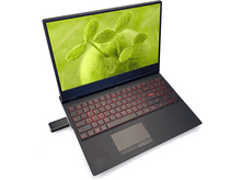 Charger l&#39;image dans la galerie, Ordinateur portable noir avec clavier rétroéclairé rouge, écran vert et clé USB.
