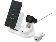 Station de charge blanche. Téléphone, montre et écouteurs dessus, avec chargeur.