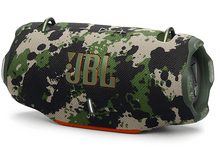 Charger l&#39;image dans la galerie, Haut-parleur JBL à motif camouflage avec accents orange, sur une surface blanche.
