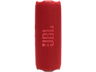 Enceinte JBL cylindrique rouge avec le logo JBL. Fond noir.
