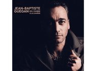 Pochette de l'album de Jean-Baptiste Guegan. Homme dans une lumière tamisée, texte 'De l'ombre à la lumière'.