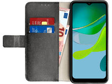 Charger l'image dans la galerie, Smartphone dans un étui portefeuille. À l'intérieur, cartes et argent. L'écran affiche un graphique vert.
