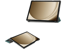 Charger l&#39;image dans la galerie, Tablette avec un écran affichant un motif d&#39;ondes dorées, dans un étui sarcelle.
