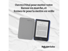 Charger l&#39;image dans la galerie, Un lecteur de livres électroniques ouvert avec du texte sur son écran et du texte au-dessus.
