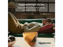 Charger l&#39;image dans la galerie, Une femme allongée sur un canapé vert porte un casque. Un appareil jaune est sur une table. Texte visible.
