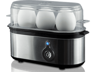 Un cuiseur d'œufs en acier inoxydable avec trois œufs à l'intérieur et un bouton d'alimentation bleu.